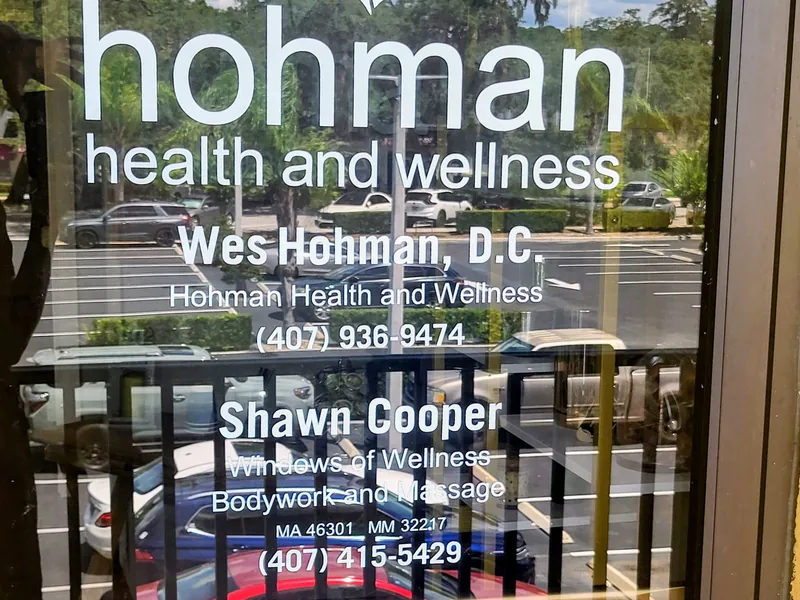 Practitioner names on the suite door including Shawn Cooper, Windows of Wellness Bodywork and Massage