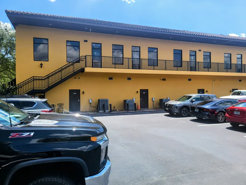 Rear parking and the outdoor staircase at 142 W. Lakeview Avenue, Lake Mary, FL