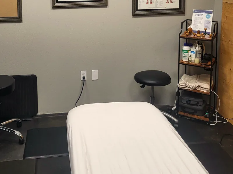 Massage table with face cradle, stool and supply cart at Windows of Wellness, Lake Mary, FL